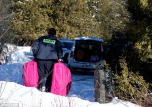 RCMP carrying luggage